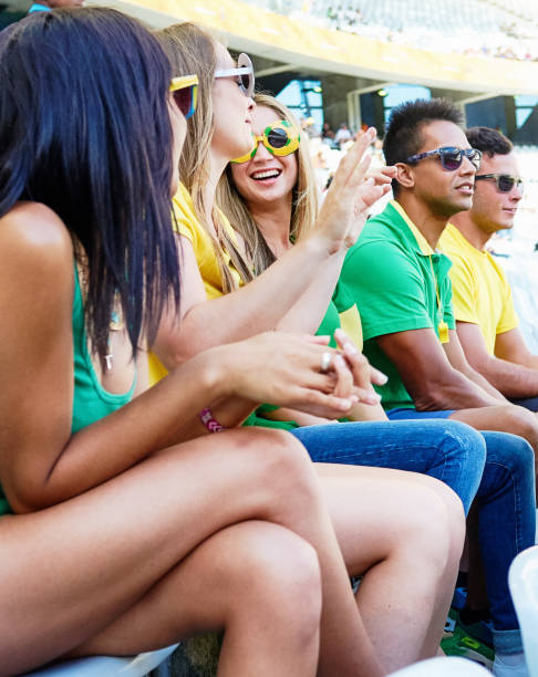 istock Sports fans: joyful soccer supporters react to match action in a stadium 2148827714