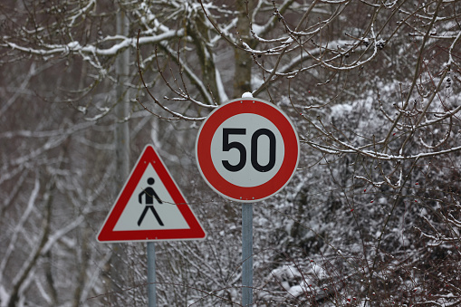 Road signs on winter background.
