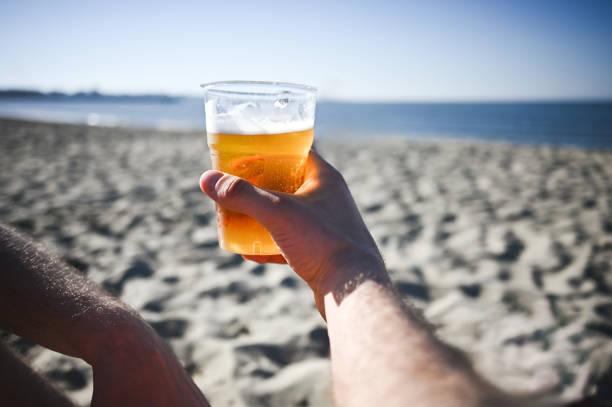 istock Close up of drinking beer on the beach. 2148831353