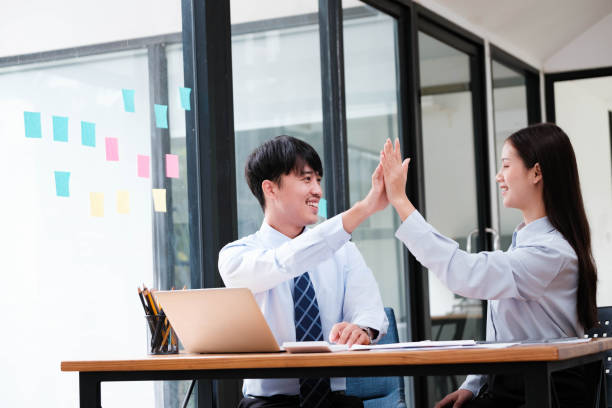 istock Successful Business Team Celebrating in Office 2148831563