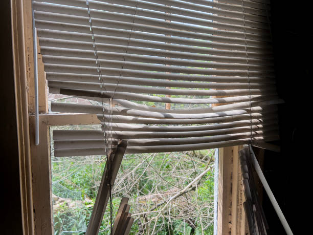 old broken venetian window blinds of an abandoned building