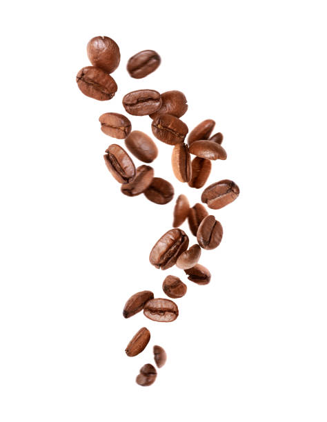 Falling coffee beans in the air close up isolated on a white background