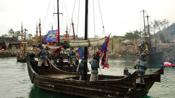 Gyeongju City, South Korea: 07.10.2022. Ancient ships on a lake in Silla Millennium Park.