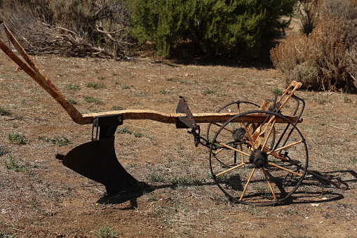Old plow on a farm as decoration.