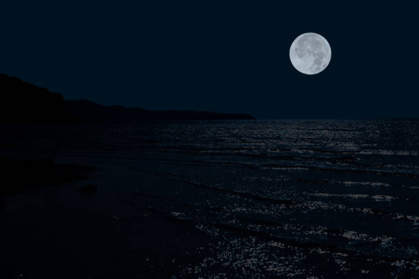 istock Full moon on sky over sea in the night. 2148840355