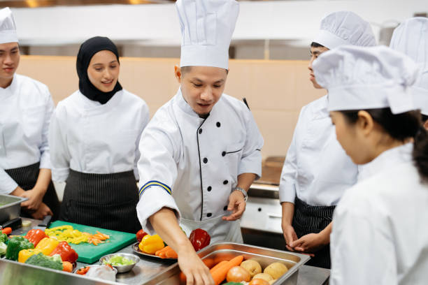 istock Professional chef conduct a cooking class in commercial kitchen 2148840399
