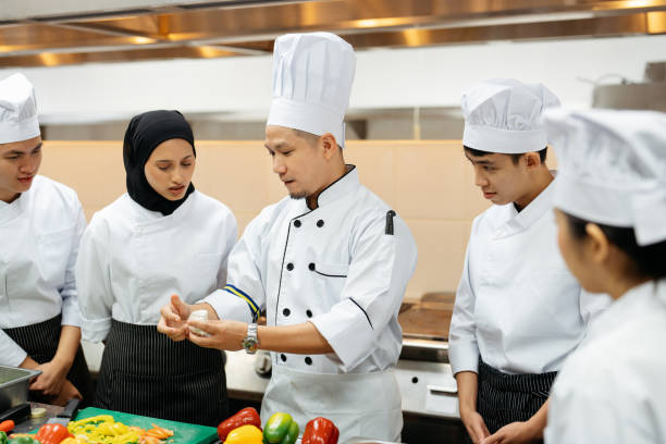 istock Chef conduct a cooking class in commercial kitchen 2148840413