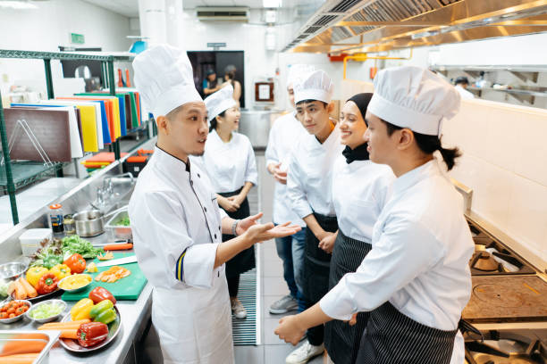 istock Professional chef conduct a cooking class in commercial kitchen 2148840446