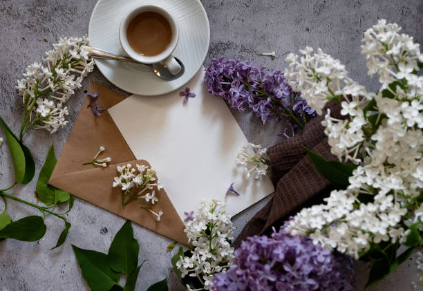 istock Composition with empty green envelope and beautiful spring lilac flowers on mint background. Mockup card invitation greeting card postcard copy space template. Branches of lilac blooming bouquet. 2148841031
