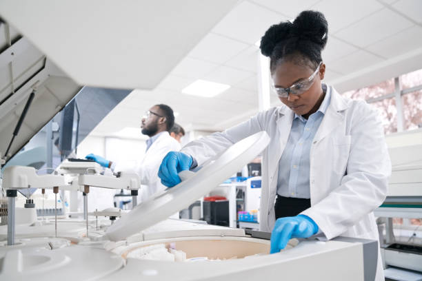 Female medical worker wearing lab coat while working in laboratory