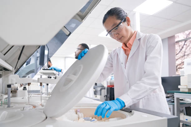 istock Female medical worker wearing lab coat while working in laboratory 2148841185