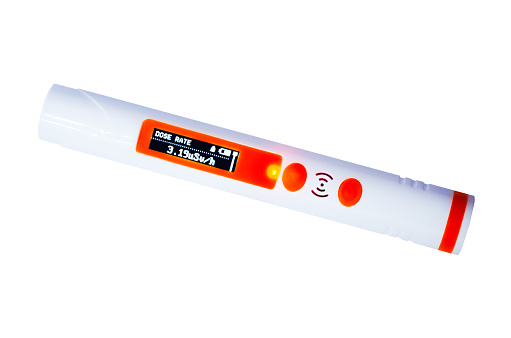 Radiation hazard Individual dosimeter form of felt-tip pen Nuclear detector X-ray Y-ray B-ray Radiation monitoring Orange flash Danger Light warning Exceeding radiation standards Copy space Isolated on white background