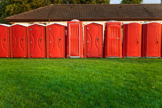 istock Portable plastic red toilets in a park - mobile sanitary system 2148842751