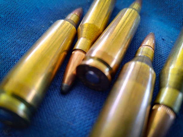 istock Shotgun cartridges over blue fabric 2148842862