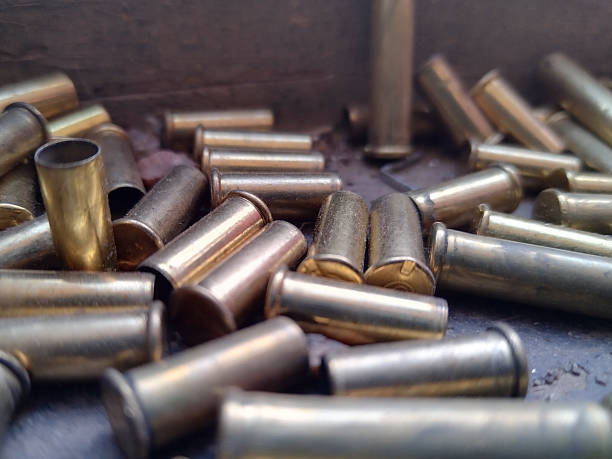istock Used shotgun cartridges over table 2148842934