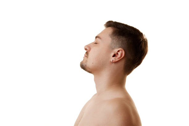 istock Side view portrait of handsome man posing with closed eyes against white studio background. Selfcare. 2148843077