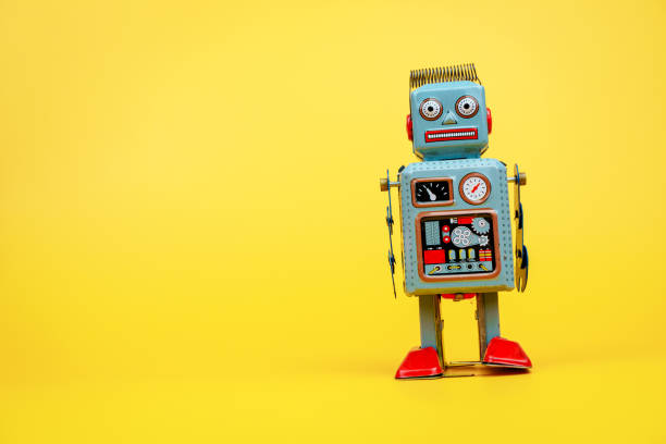 istock Retro tin robot, tin robot on yellow background. 2148843472