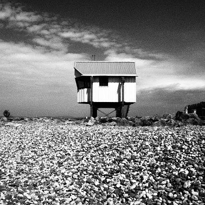 Raised house on shingle beach