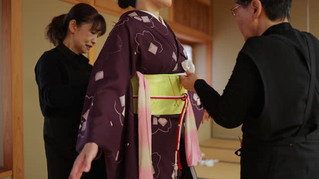 Female tourist wearing kimono in Japanese tatami room - part 2 of 4