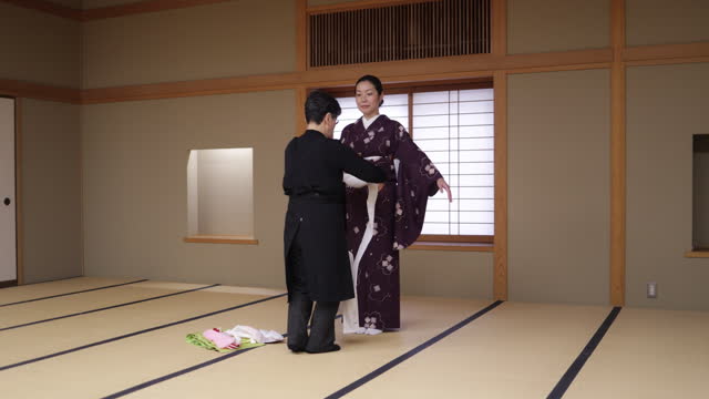 Female tourists wearing kimono in Japanese tatami room
