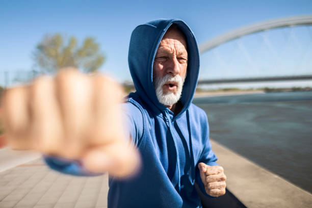 istock Senior fighter shadow boxing outdoors 2148847776