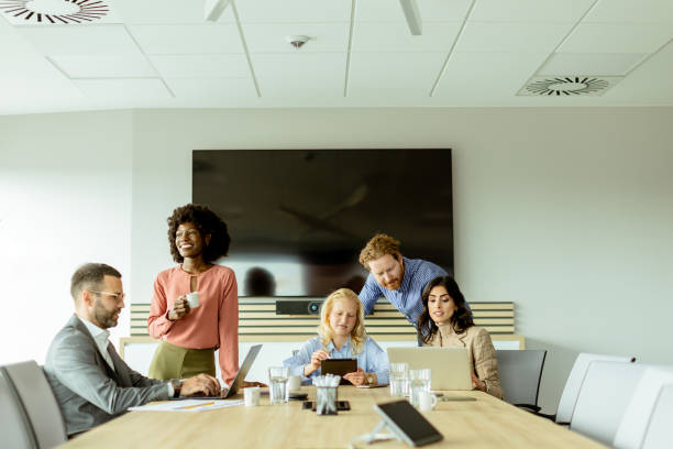 istock Diverse team engaging in collaborative efforts during a creative office meeting at midday 2148848747