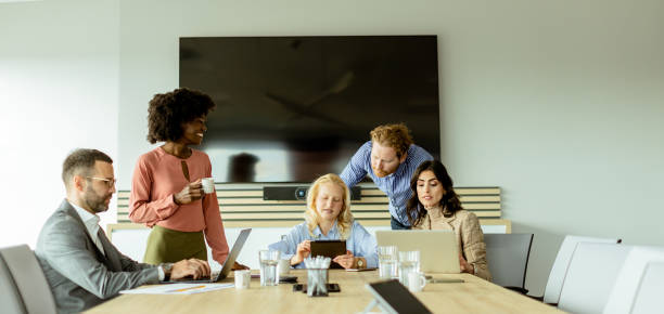 istock Diverse team engaging in collaborative efforts during a creative office meeting at midday 2148848748