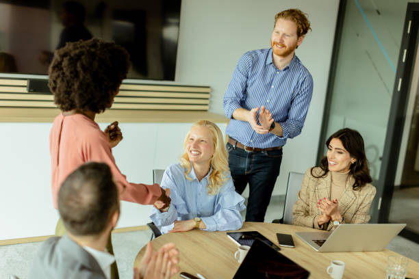 istock Diverse team engaging in collaborative efforts during a creative office meeting at midday 2148848754