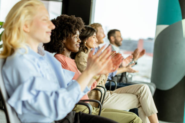 istock Energetic applause by a diverse group at a casual indoor event 2148848777