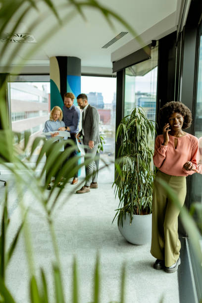 istock Radiant smile and casual networking in a modern office environment at midday 2148848782