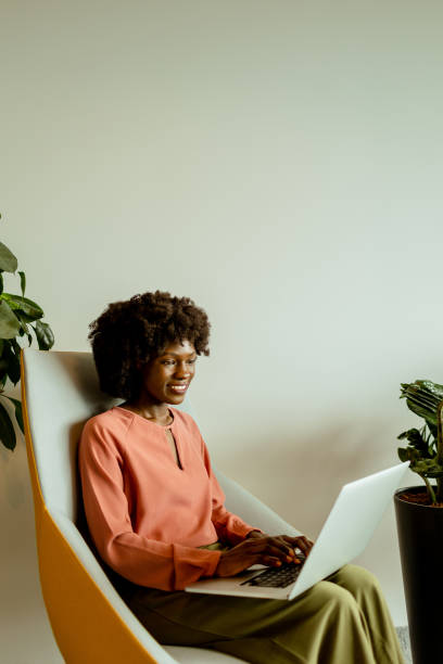 istock Radiant African American entrepreneur innovating at her modern workspace during a peaceful morning 2148848791