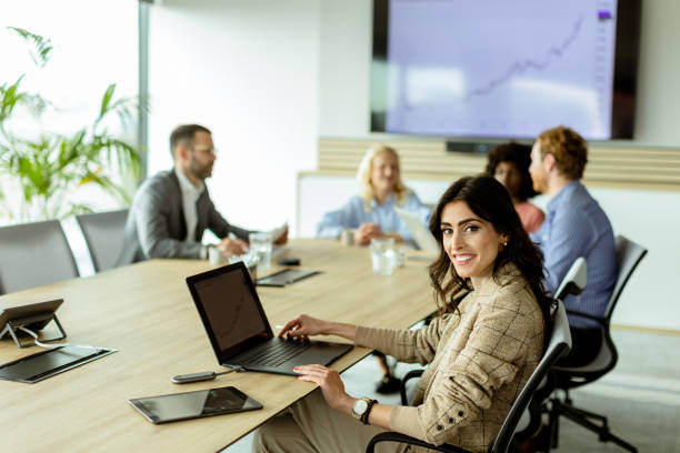 istock Radiant professional woman excels during a dynamic office meeting in bright workspace 2148848810