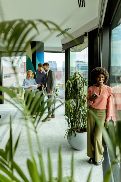 istock Radiant smile and casual networking in a modern office environment at midday 2148848827