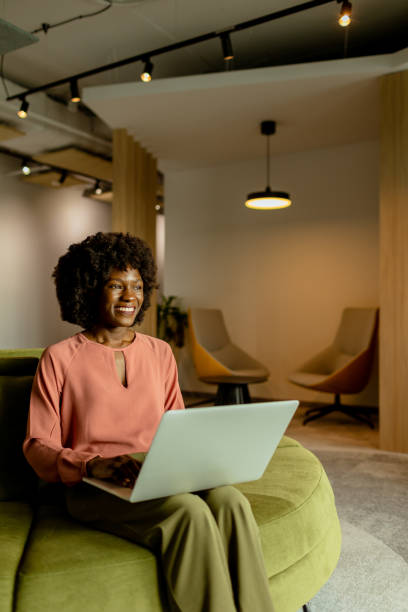 istock Radiant African American entrepreneur innovating at her modern workspace during a peaceful morning 2148848839
