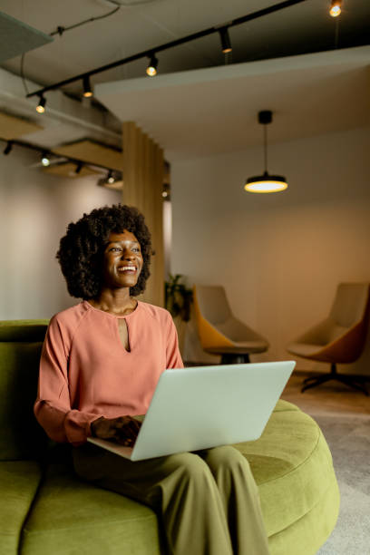 istock Radiant African American entrepreneur innovating at her modern workspace during a peaceful morning 2148848899