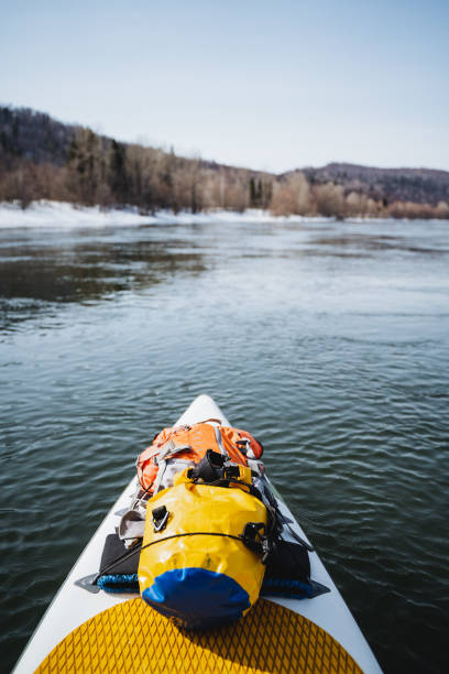 istock Things for rafting are packed in a waterproof bag, equipment for rafting on the river, a tourist water route, dry packaging on the nose of the SUP board. 2148849102