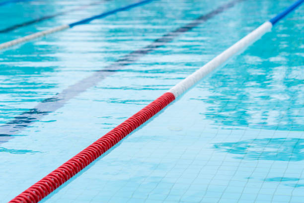 istock competition pool with blue water and marked swimming lanes 2148849280