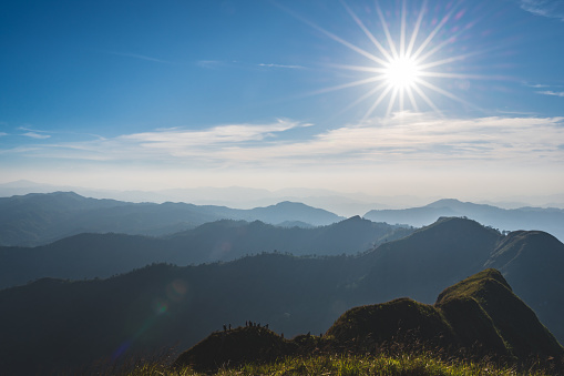 silhouette people with Beautiful landscape view and layers mountains on khao khao chang phueak mountian.Thong Pha Phum National Park's highest mountain is known as Khao Chang Phueak