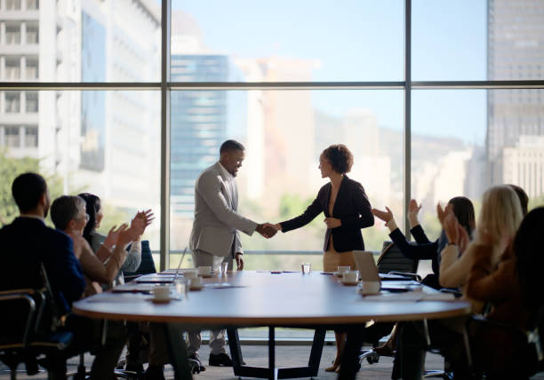 Meeting, handshake and business people in office for interview, welcome applause or onboarding for collaboration. Men, women and shaking hands in conference room for agreement, consulting or b2b deal Meeting, handshake and business people in office for interview, welcome applause or onboarding for collaboration. Men, women and shaking hands in conference room for agreement, consulting or b2b deal. mergers and acquisitions stock pictures, royalty-free photos & images
