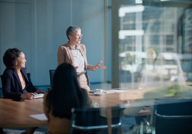istock Meeting, business man and presentation in boardroom for discussion, planning or problem solving. Professional, office and male employee with staff for corporate idea, vision or collaboration 2148852706
