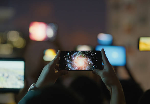 Cellphone, hands and stars on screen, galaxy and space in sky for entertainment on internet. Technology, telescope and photo of constellation for science, explore and information or education in dark