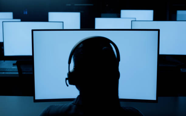 istock Person with headphones, desktop or screen at night in information technology lab with developer or programmer. Software development, networking and system administration for computer in call centre 2148853366