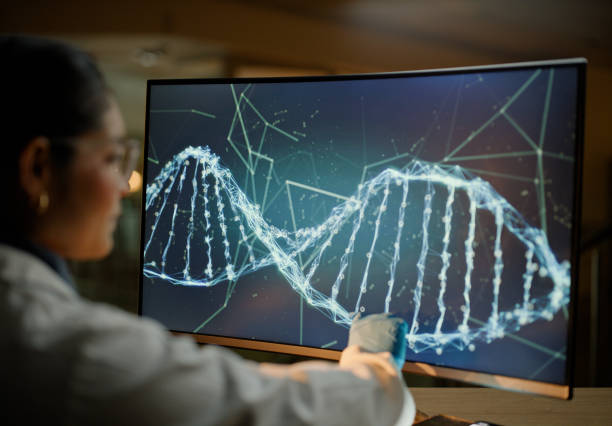 istock Woman, computer screen and dna ​for lab research or gene therapy or anti aging science, futuristic or innovation. Female person, pointing and double helix for medical tech, chromosome or chemistry 2148853421