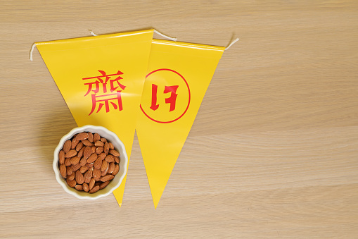 Vegetarian festival triangle flag with almond, Translation for Chinese and Thai letter is stand for symbol text of vegetarian festival or the meaning of refrain eating meat.