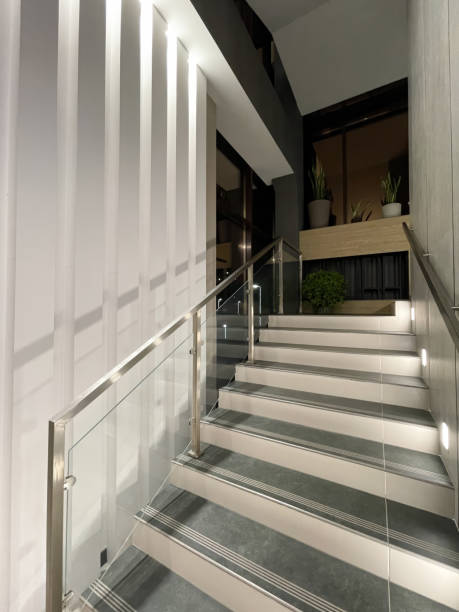 istock Indoor staircase with backlighting and glass railing 2148853942
