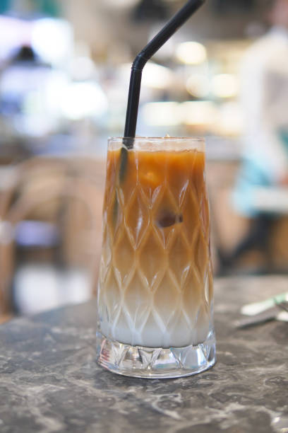 istock iced late in a transparent glass on cafe table 2148854061