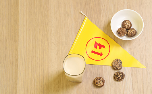 Vegetarian festival triangle flag with Dried Shiitake mushrooms  and Glass of soybean milk, Translation for Chinese and Thai letter is stand for symbol text of vegetarian festival or the meaning of refrain eating meat.