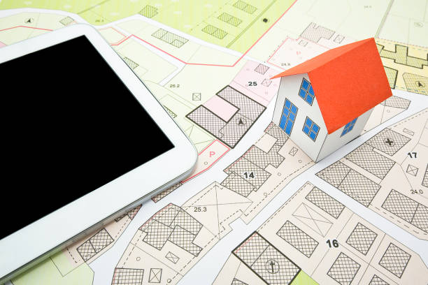 istock Buildings Permit concept with imaginary cadastral on digital tablet - building activity and construction industry concept with General Urban Plan and home model 2148854498