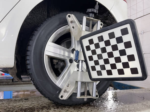 istock Wheel balancing in a workshop with equipment 2148855126