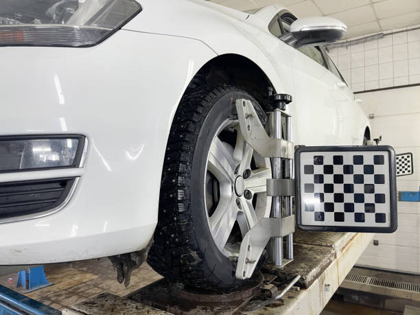 istock Wheel balancing in a workshop with adjustment equipment 2148855150